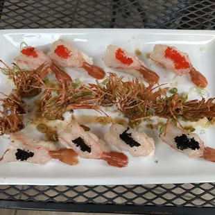 a plate of shrimp and cavia