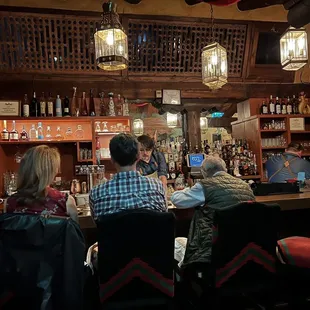 people sitting at the bar