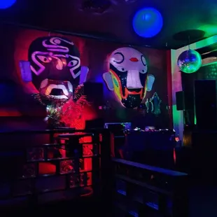 a dark room with neon lights