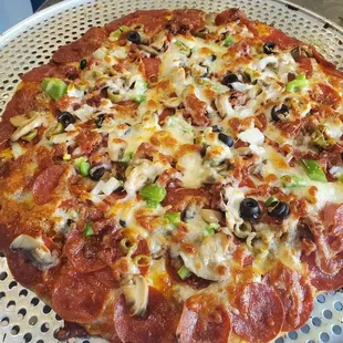 Homemade pizza dough hand rolled and topped with your favorite ingredients.