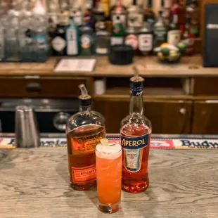 two bottles of liquor on the bar counter