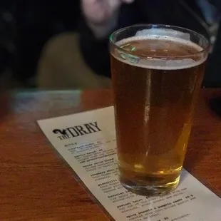 a glass of beer on a table