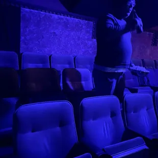 A very attractive individual selecting a seat