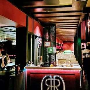 Reception counter, diningroom; bar to the left.