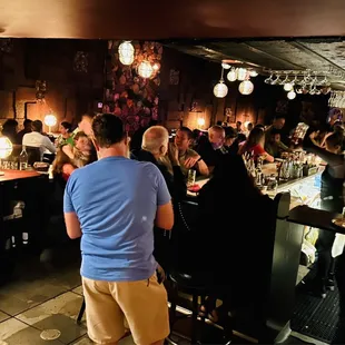 a group of people sitting at a bar