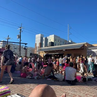 a crowd of people sitting and standing