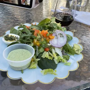 a plate of salad with dressing