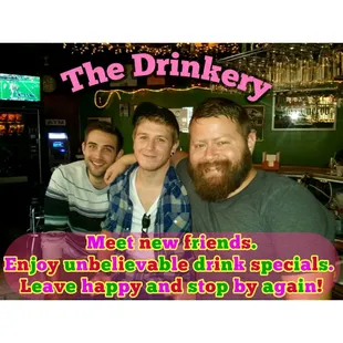 three men sitting at a bar