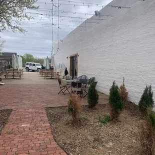 Patio area with Corn hole and lots of seating.