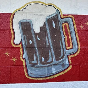 a mug of beer on a wall