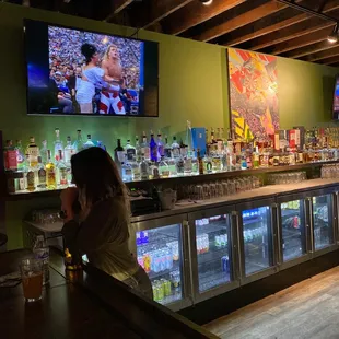 a woman sitting at a bar