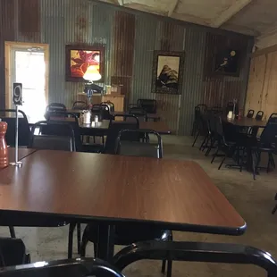 a dining room with tables and chairs