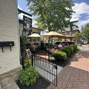 View of patio from sidewalk, really cute!