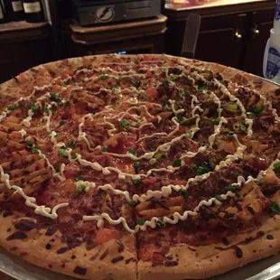 Nacho pizza with half meat.