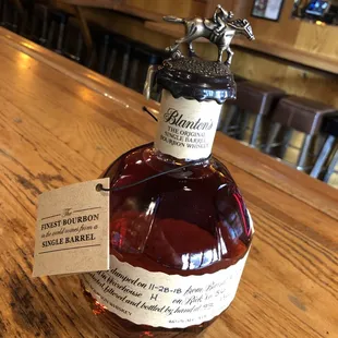 a bottle of bourbon on a bar