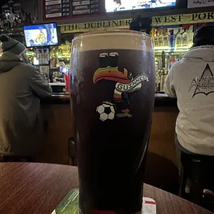 a pint of guinness in a pub