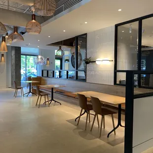 a dining area with a table and chairs