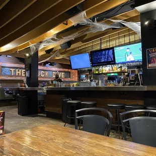 a bar with tables and chairs