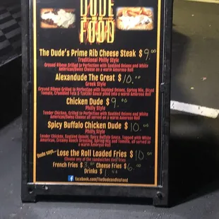 a menu for the dude and his food