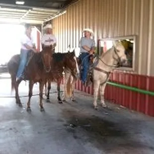 a group of people riding horses