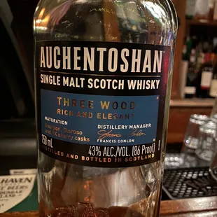 a bottle of auchento shan single malt scotch whisky