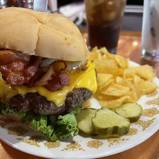a burger and chips on a plate
