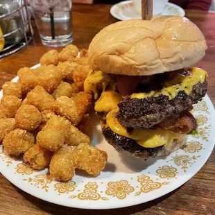 Bacon cheese burger with a double patty, lettuce, and ketchup.