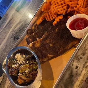 Slow-Smoked St. Louis Ribs Brussels sprouts Sweet Potato Fries