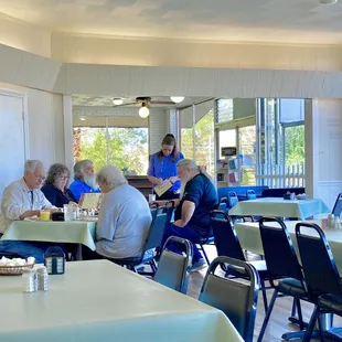 a group of people sitting at tables