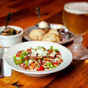 a plate of food and a glass of beer