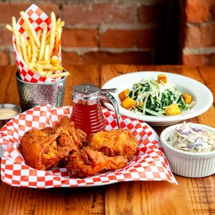 a plate of fried chicken and a bowl of coleslaw