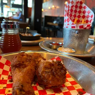 Fried drumsticks and fries