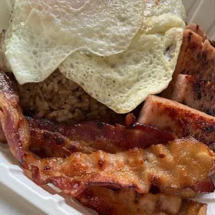 bacon and eggs in a styrofoam container