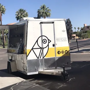 a bird painted on the side of a food truck