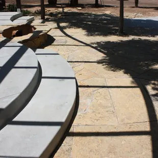a curved concrete seating area