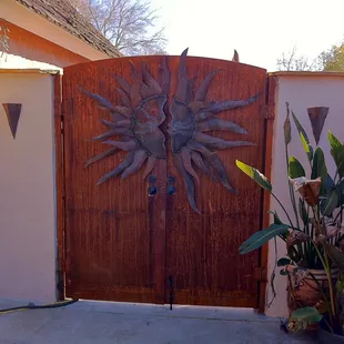 a gate with a sun on it
