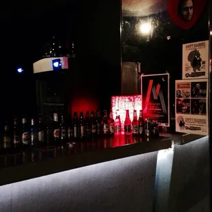 a bar with bottles of alcohol