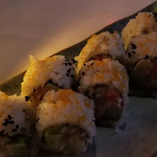 a plate of sushi rolls