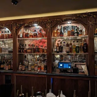 a bar with many bottles of alcohol