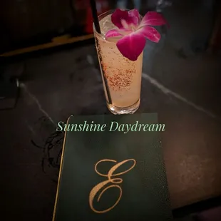 a drink with a flower in it