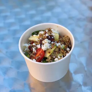 Quinoa Salad:Tri-color quinoa, zucchini, grape tomatoes, spinach, cranberries, candied walnuts, goat cheese, and lemon vinaigrette w/ lavash