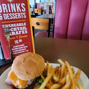 a burger and fries on a plate