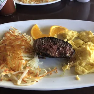 Steak (medium rare), scrambled eggs, and hash browns.