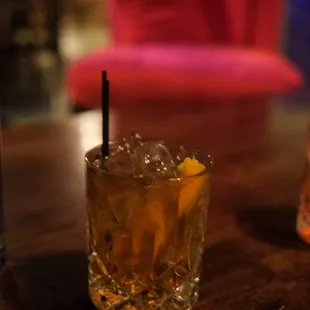 a glass of alcohol on a table