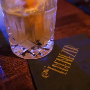 a drink in a glass on a table