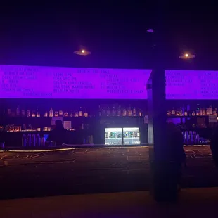 a bar with purple lighting