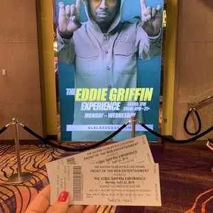 a hand holding a ticket