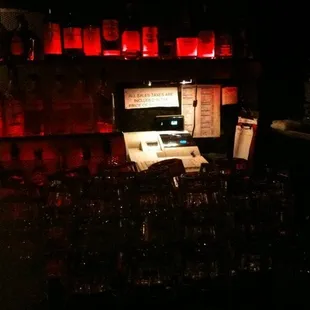 a bar with a lot of wine glasses