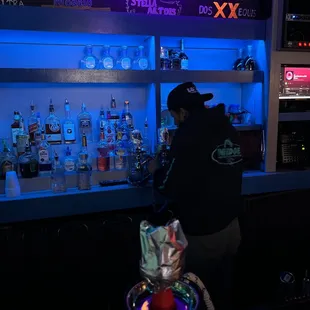 a man standing at a bar