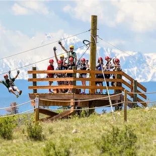 At the top of zip line #3 with a beautiful view of Pikes Peak